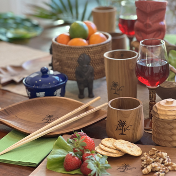 Spread featuring Trader Vic's glassware and plateware