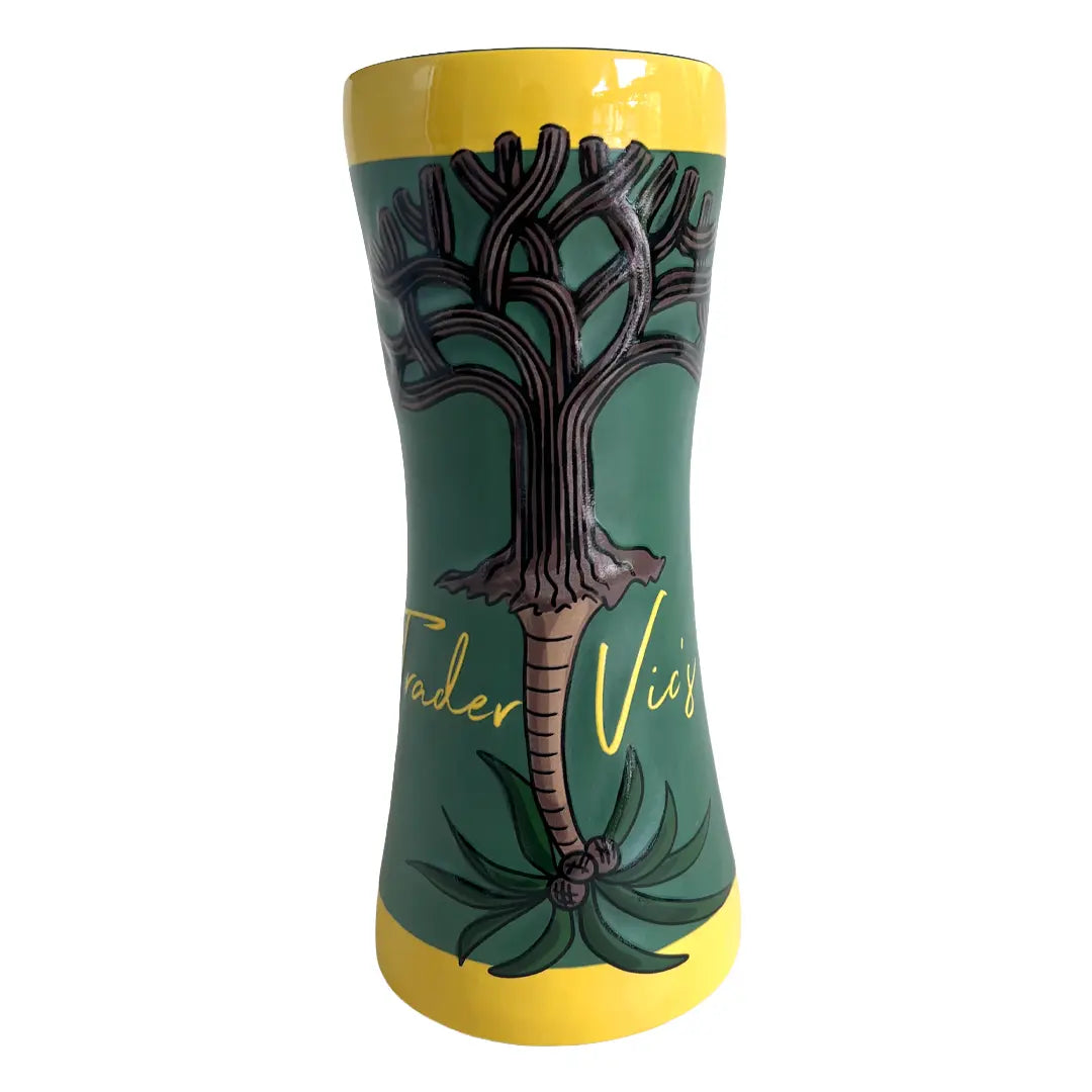 Green and yellow mug with tree design.