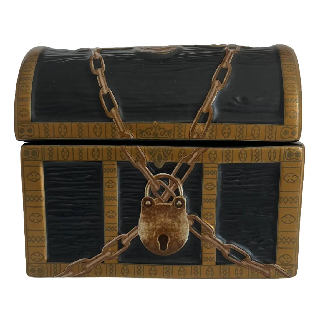 A decorative treasure chest with a dark textured finish, gold-toned trim, a padlock, and crossed chain details, shown on a plain white background.