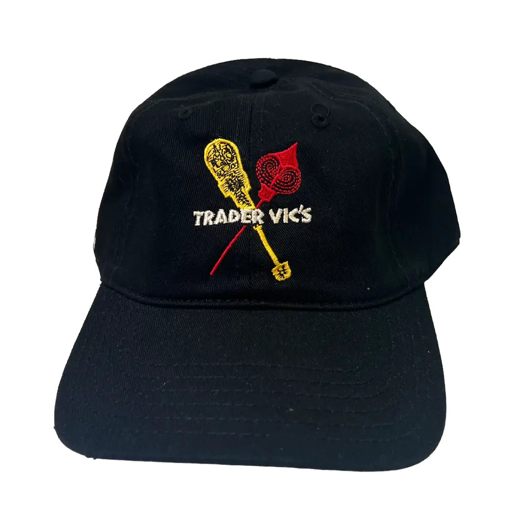 Black cap with embroidered design and 'Trader Vic's' text on a white background