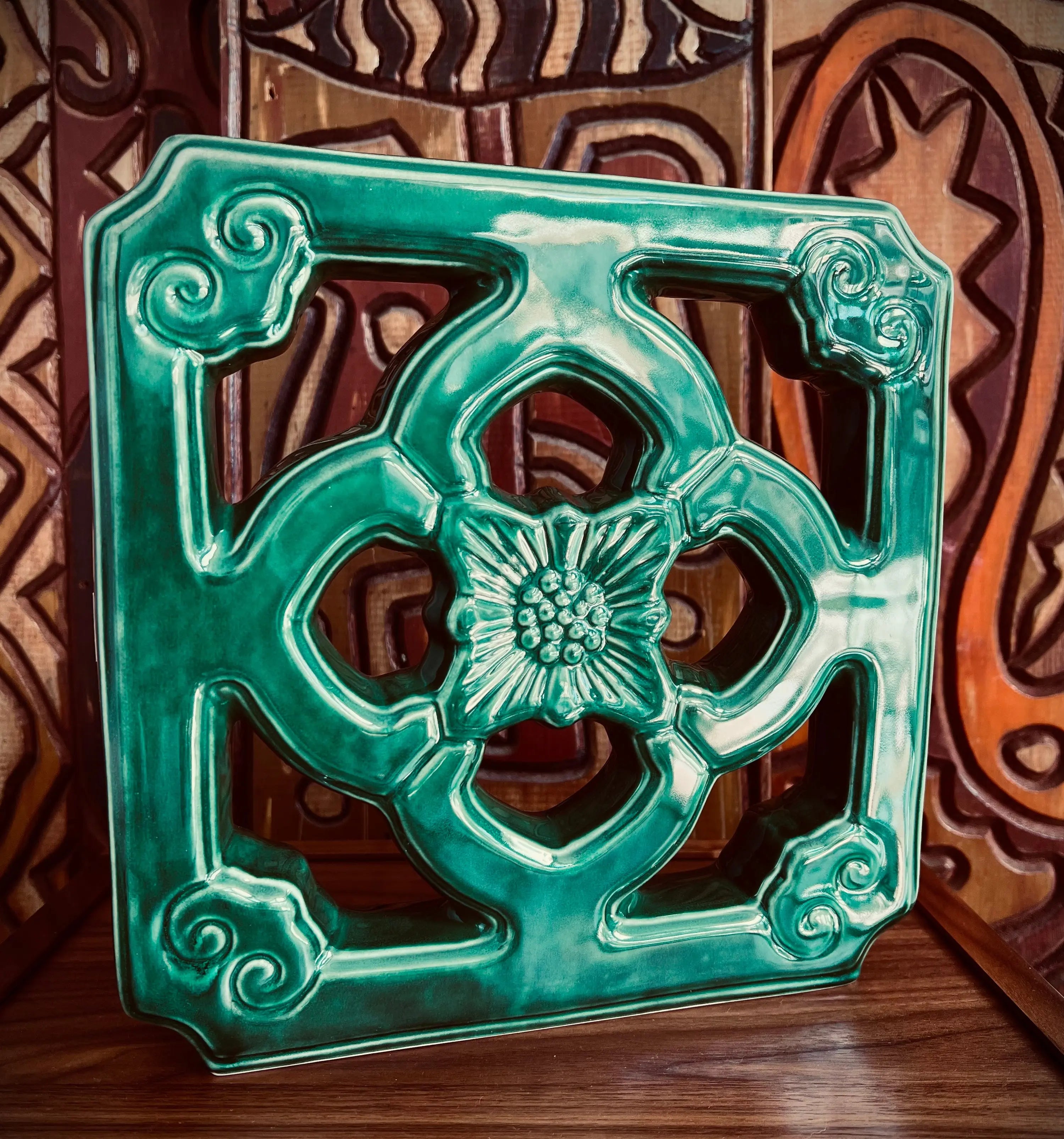 Trader Vic's ceramic Crik tile in a new size, featuring a glossy jade-green decor tile with intricate patterns.