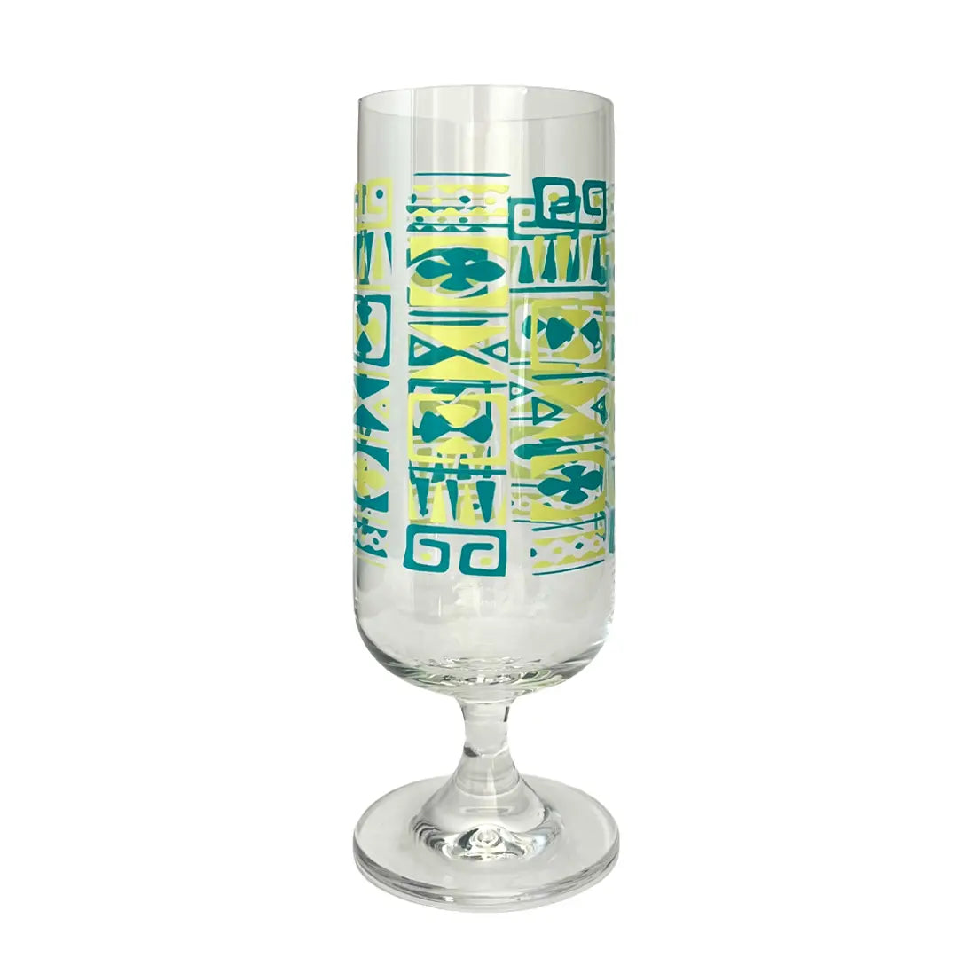 A clear glass goblet with a teal and yellow geometric pattern, shown on a solid white background.