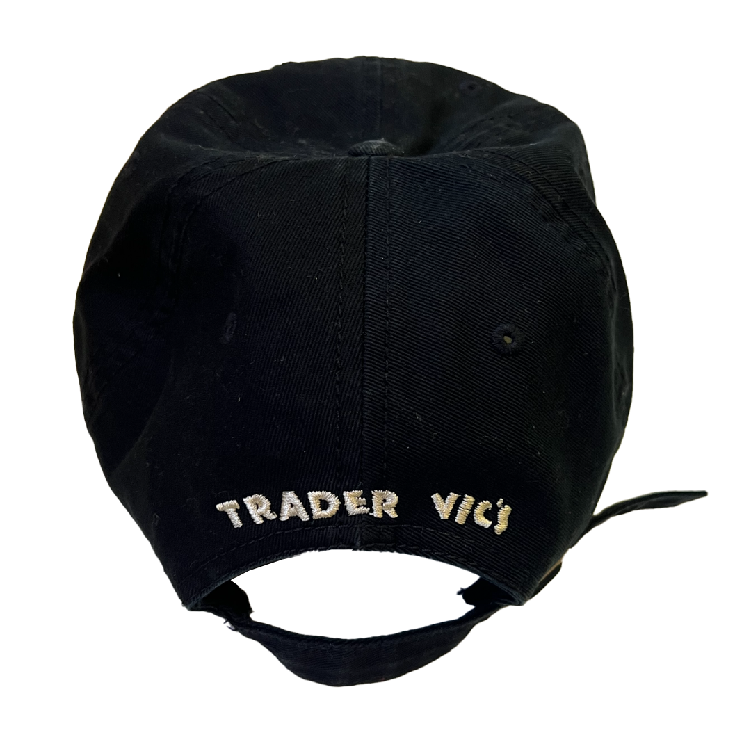 Black cap with 'TRADER VIC' embroidered on the back against a white background