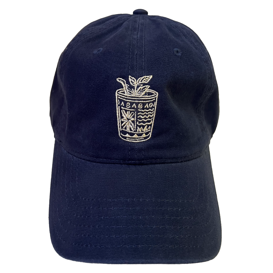 Navy blue cap with embroidered design on a white background