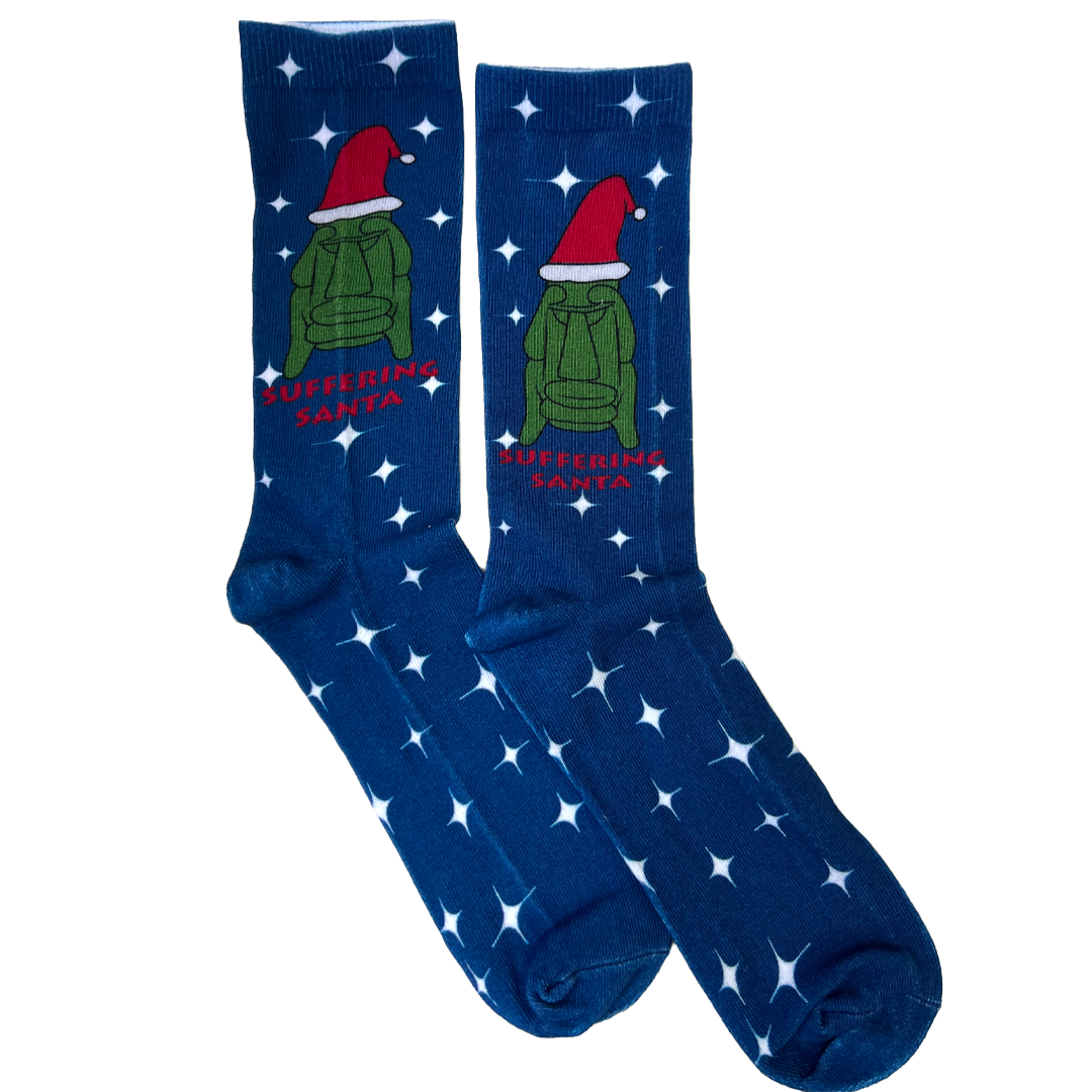 Blue socks with a green sweater and red Santa hat graphic on a white background