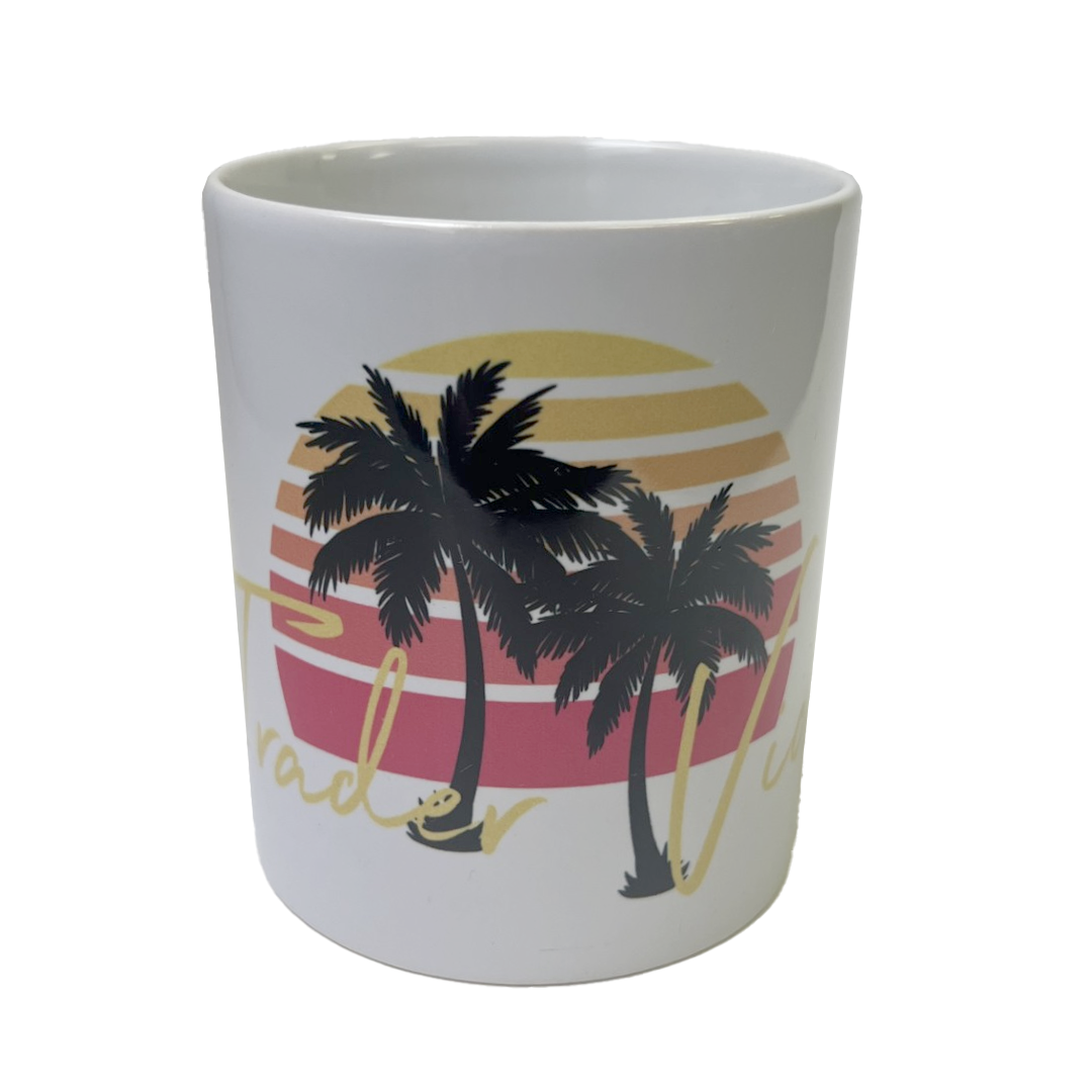 White mug with palm tree design and sunset on a white background