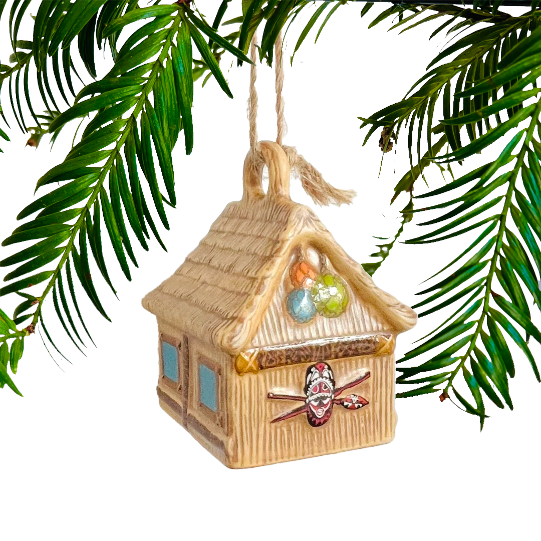 Decorative straw hut ornament with colorful elements on a white background