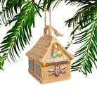 Decorative straw hut ornament with colorful elements on a white background